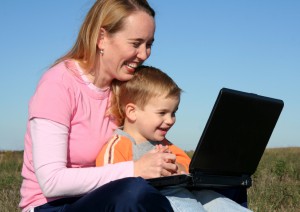 Computer Time Mother and Son working on laptop